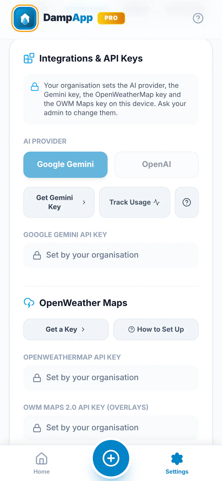 DampApp Pro Settings, Integrations tab, on a B2B device: the Gemini and OpenWeatherMap key boxes read Set by your organisation, under a note that the organisation sets them